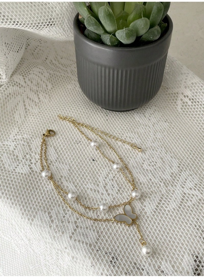 veya A Chic Anklet Adorned With A Shiny Butterfly And Elegant Artificial Pearls For A Soft Feminine Look. - Image 2
